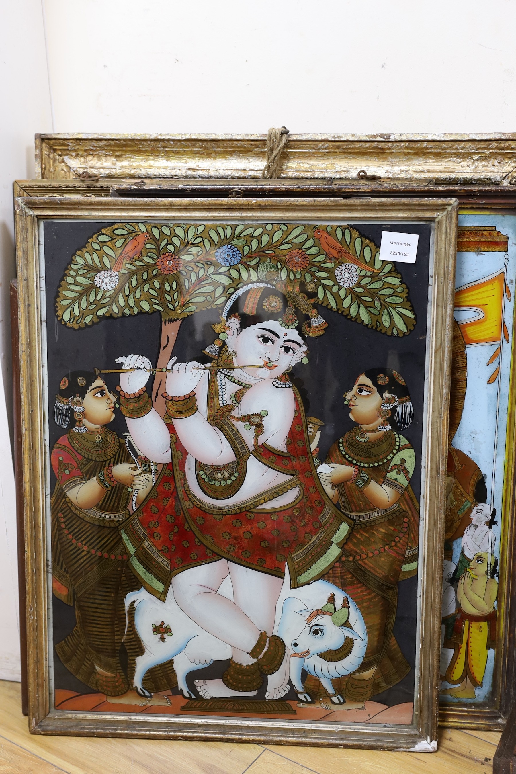 A collection of eight Indian reverse decorated glass pictures, 20th century, largest frame 70cm X 60cm